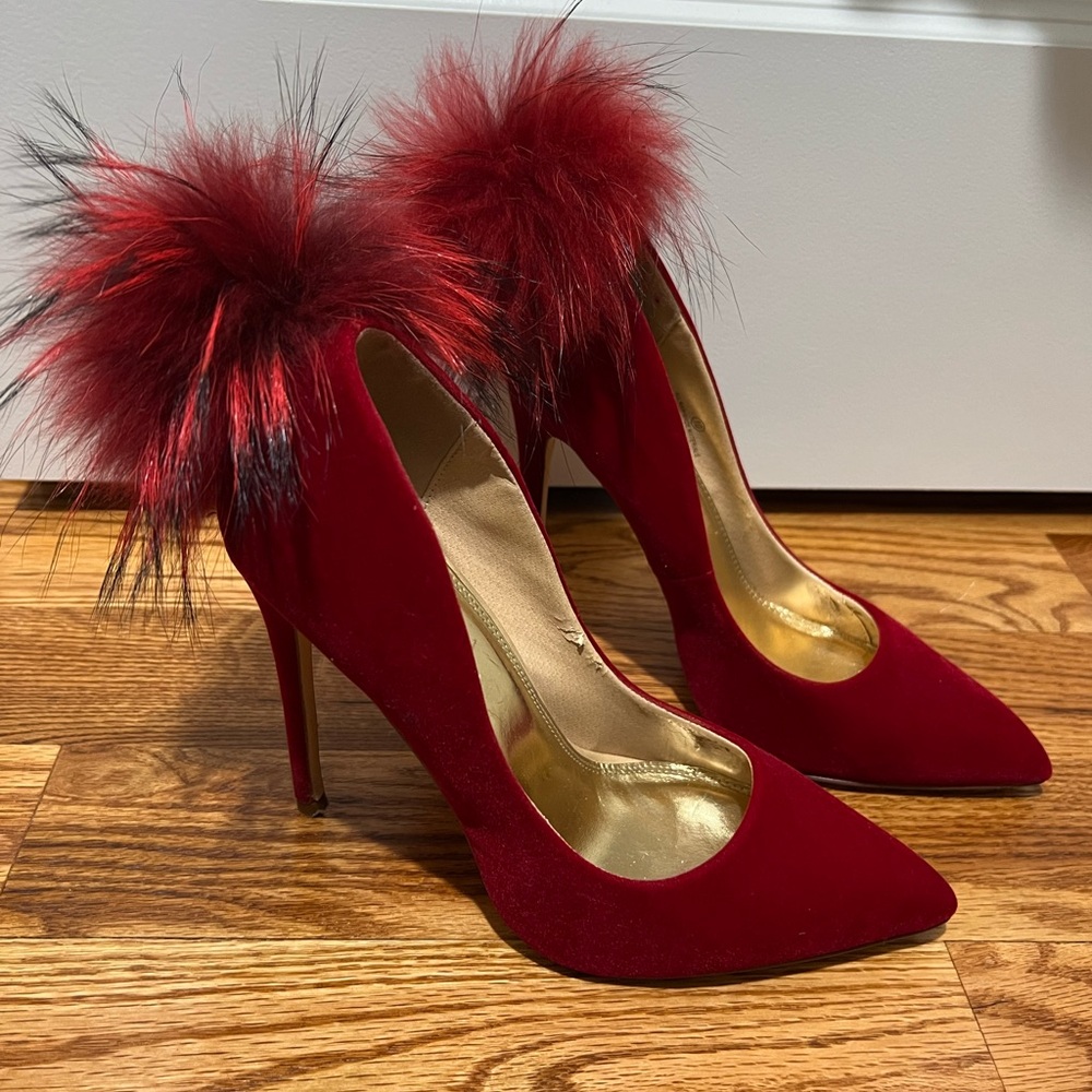 Gently worn pumps with red pom poms